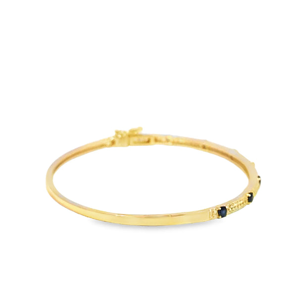 Brazalete en oro amarillo de 14K con diamante de 0.28CT y zafiro de 0.52CT