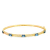 Brazalete en oro amarillo de 14K con diamante de 0.24CT y topacio azul