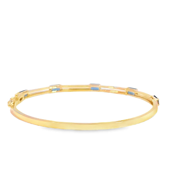 Brazalete en oro amarillo de 14K con diamante de 0.24CT y topacio azul