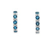 Aretes en oro blanco de 14K con diamante de 0.17CT y topacio London Blue de 1.26CT