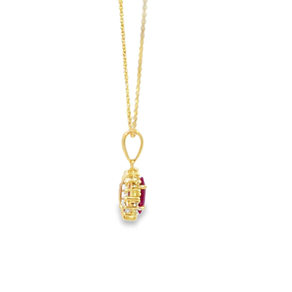 Dije con cadena en oro amarillo de 14K con diamante de 0.14CT y rubí de 0.96CT