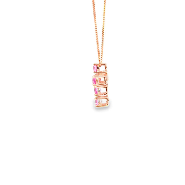 Cruz con cadena en oro de 14K con diamante de 0.76 ct y zafiro rosa
