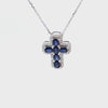 Cruz con cadena en oro blanco de 14K con 0.33 ct en diamantes y 1.39 ct de zafiro