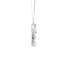 Cruz con cadena en oro blanco de 14K con esmeralda de 0.27 ct