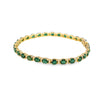 Brazalete en oro amarillo de 14K con diamantes de 0.31 ct y esmeralda de 10 ct