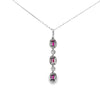 Dije con Cadena en 14K en Oro Blanco con 0.47CT en Rubíes