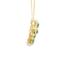 Cruz con cadena en oro amarillo de 14K con 0.32 ct en diamantes y 1.1 ct en esmeraldas