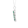 Cruz con cadena en oro blanco de 14K con 0.48 ct en diamantes y 3.81 ct de esmeraldas