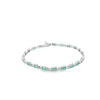 Brazalete en oro blanco de 14K con 1.80 ct de diamantes y esmeraldas