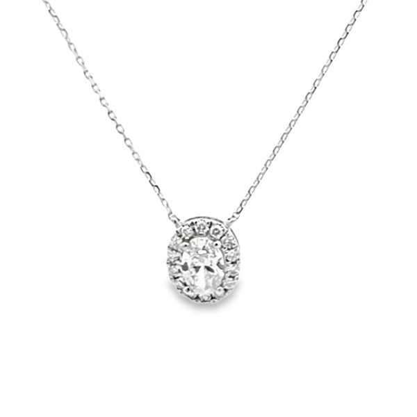Dije con cadena en oro blanco de 14K con diamante ovalado de 0.50 ct