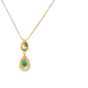 Dije con cadena bicolor en oro de 14K con diamante de 0.11 ct, esmeralda de 0.34 ct