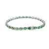 Brazalete en oro blanco de 14K con diamantes de 0.31 ct y esmeraldas de 10.01 ct