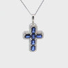 Cruz con cadena en oro blanco de 14K con 0.48 ct en diamantes y 3.81 ct en zafiros