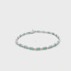 Brazalete en oro blanco de 14K con 1.80 ct de diamantes y esmeraldas